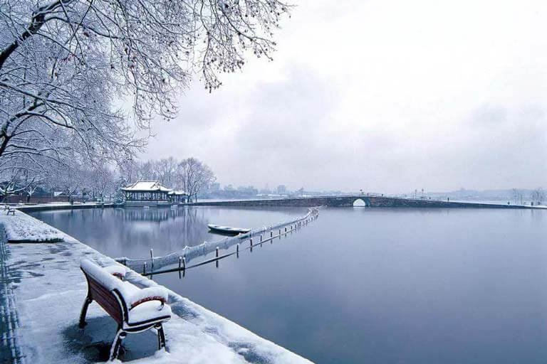 Lingering Snow over the Broken Bridge in Winter