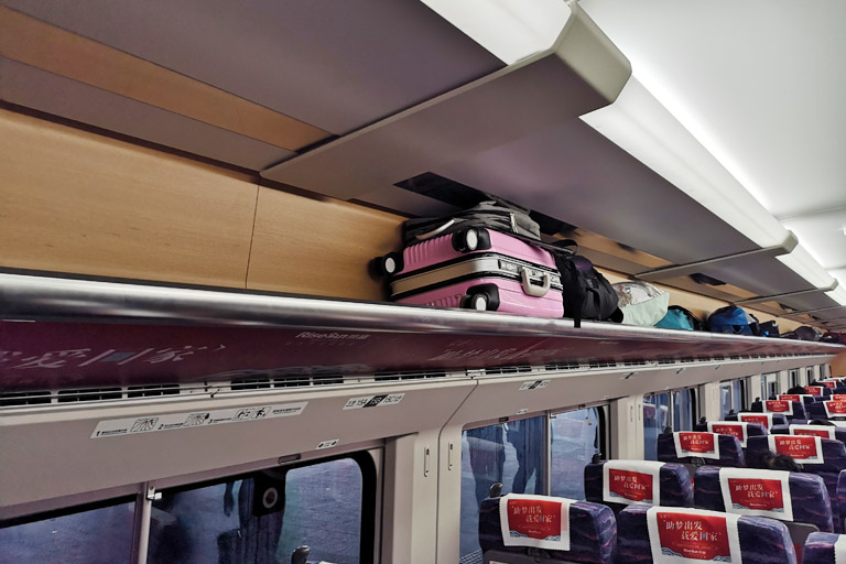 Luggage racks above seats in 2nd Class Seats China (High Speed) Train Travel Guide 2024