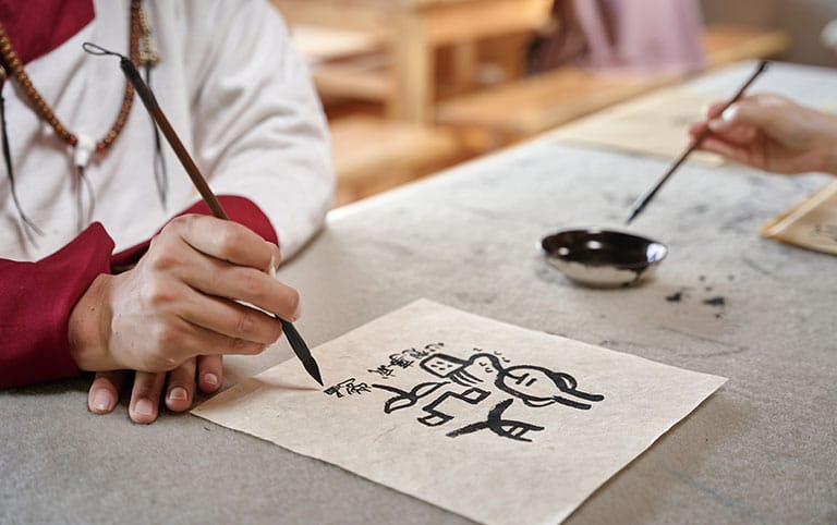 Club Med Lijiang Naxi Characters Write Leaning