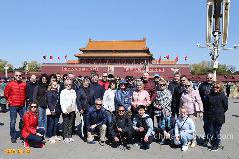 Woo's Group from Latvia took a photo with our experienced travel consultant Leo at Beijing Tian'anmen Square