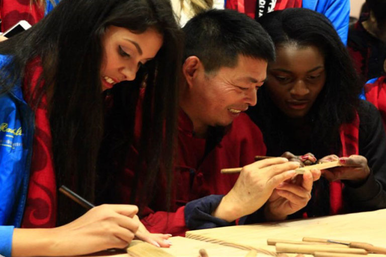 Miss World Learning Wood Carving in Hui-style Carving Museum