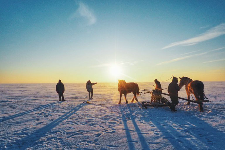 Fishermen Digging A Hole on Iced Lake Chagan Lake