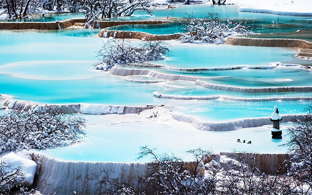 Travertine lake terraces in winter days of Huanglong Valley