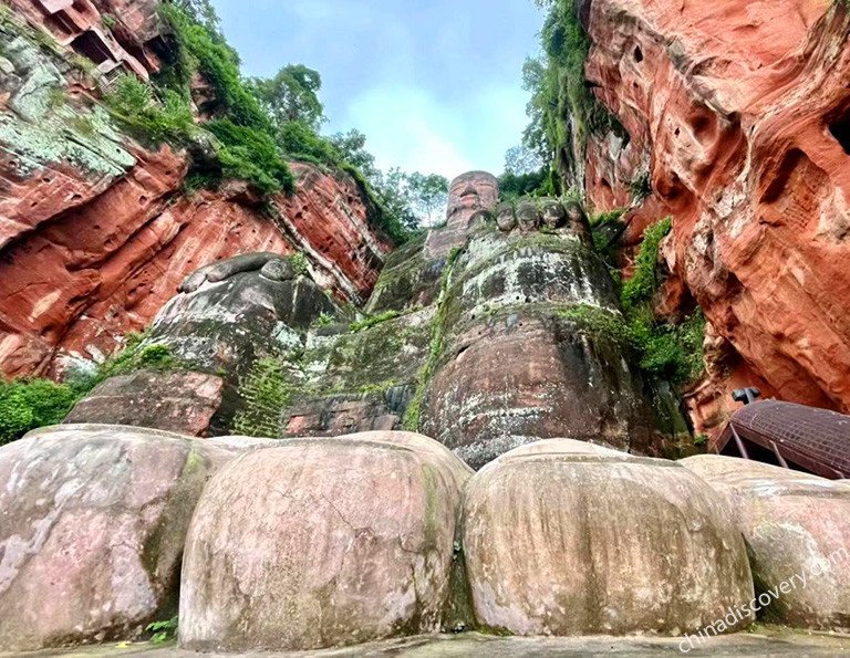 Look up at Leshan Giant Buddha from its foot stage