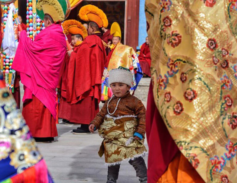 A lovely Tibetan kid during Shaman Festival in Tongren