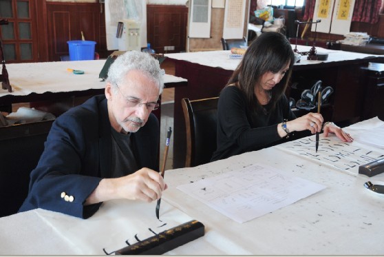 Senior Traveler Practising Calligraphy