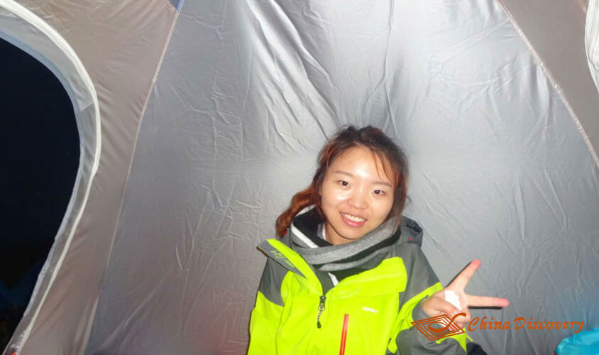 my wife was wearing a scarf and a jacket inside the tent. Jiuding Mountain Hiking Tour