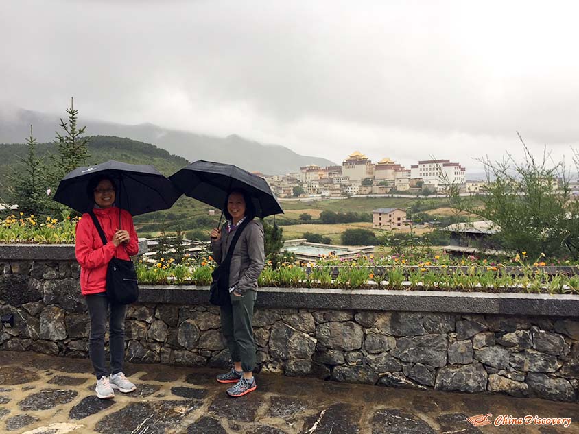 Mrs. Maa and Her Daughter with Sumtseling Monastery in the Background, Tour Customized by Vivien