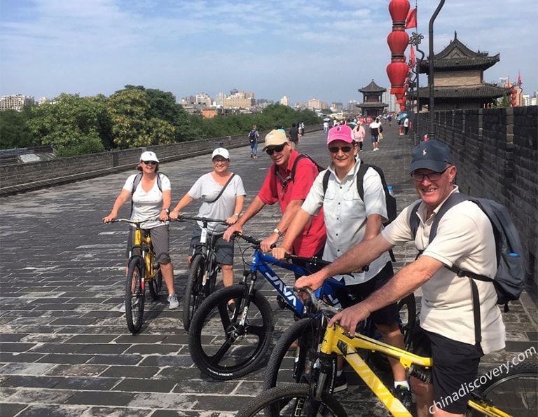 Our guest Lewis cycling on the Ancient City Wall of Xian in 2017