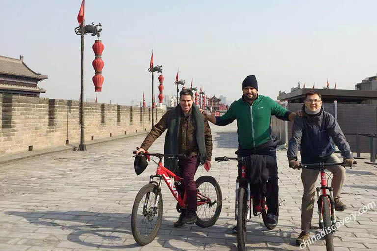 Our French Guests Had Fun in Biking on Ancient City Wall of Xian China Xian Tours